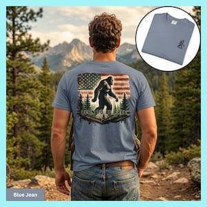 Bigfoot T-shirt Sasquatch Shirt Gift for Dad American Flag Design Forest Scene Background Cotton Construction Comfort Colors Brand Perfect Father's Day Gift Outdoor Adventure Style Hiking Enthusiast Collection Casual Wear