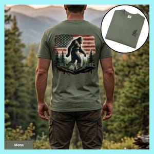 Bigfoot Shirt Design American Flag Pattern Forest Scene Background Comfort Colors Cotton Tee Outdoor Adventure Style Fathers Day Gift Perfect Nature Lover Present Hiking Camping Enthusiast Casual Wear Premium Quality Construction Patriotic