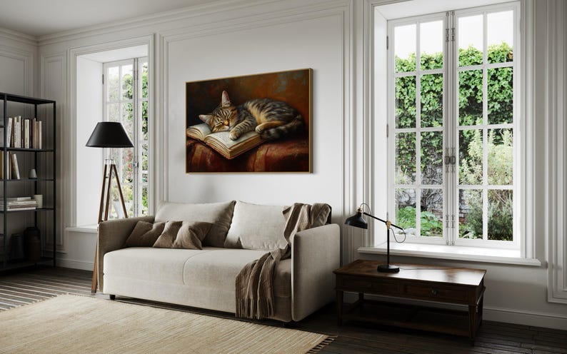 This heartwarming art print captures a peaceful kitten sleeping on an open book. The soft lighting and cozy atmosphere make this piece perfect for book lovers and cat enthusiasts alike. The detailed brushstrokes highlight the kitten’s fluffy fur, creating a charming and serene scene. Whether for a reading nook, bedroom, or study, this print adds warmth and relaxation to any space. A perfect gift for literature lovers, pet owners, or anyone who appreciates quiet, dreamy moments.