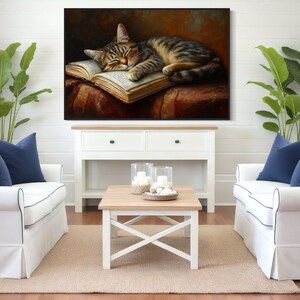 This heartwarming art print captures a peaceful kitten sleeping on an open book. The soft lighting and cozy atmosphere make this piece perfect for book lovers and cat enthusiasts alike. The detailed brushstrokes highlight the kitten’s fluffy fur, creating a charming and serene scene. Whether for a reading nook, bedroom, or study, this print adds warmth and relaxation to any space. A perfect gift for literature lovers, pet owners, or anyone who appreciates quiet, dreamy moments.