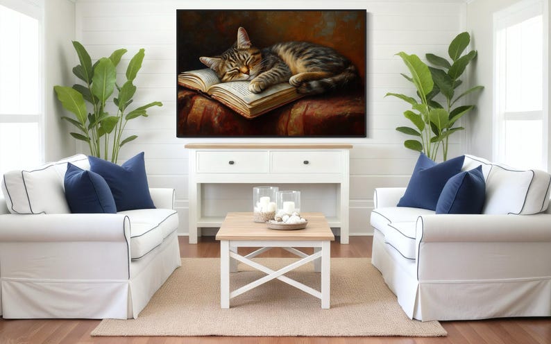 This heartwarming art print captures a peaceful kitten sleeping on an open book. The soft lighting and cozy atmosphere make this piece perfect for book lovers and cat enthusiasts alike. The detailed brushstrokes highlight the kitten’s fluffy fur, creating a charming and serene scene. Whether for a reading nook, bedroom, or study, this print adds warmth and relaxation to any space. A perfect gift for literature lovers, pet owners, or anyone who appreciates quiet, dreamy moments.