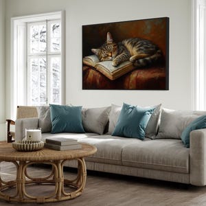This heartwarming art print captures a peaceful kitten sleeping on an open book. The soft lighting and cozy atmosphere make this piece perfect for book lovers and cat enthusiasts alike. The detailed brushstrokes highlight the kitten’s fluffy fur, creating a charming and serene scene. Whether for a reading nook, bedroom, or study, this print adds warmth and relaxation to any space. A perfect gift for literature lovers, pet owners, or anyone who appreciates quiet, dreamy moments.