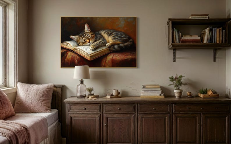 This heartwarming art print captures a peaceful kitten sleeping on an open book. The soft lighting and cozy atmosphere make this piece perfect for book lovers and cat enthusiasts alike. The detailed brushstrokes highlight the kitten’s fluffy fur, creating a charming and serene scene. Whether for a reading nook, bedroom, or study, this print adds warmth and relaxation to any space. A perfect gift for literature lovers, pet owners, or anyone who appreciates quiet, dreamy moments.