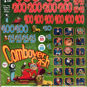 May include: A green scratch-off lottery ticket with the text "Combover Cash" and various prize amounts in red. The ticket features cartoon illustrations and the text "$1 per chip". The ticket is sealed in clear plastic.