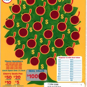 May include: A colorful Cherry Tree pull-tab ticket with a yellow background. The design features a tree with red cherries and dollar signs. Text includes "$1 Play", "Cherry Tree", and prize amounts.