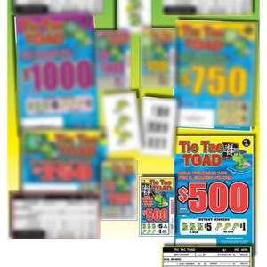 May include: A collection of colorful "Tic Tac Toad" scratch-off lottery tickets. The tickets feature a cartoon frog and the text "$1000", "$750", and "$500". The tickets are on a green and yellow background.