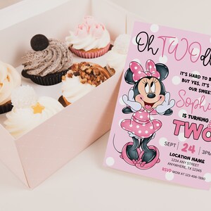 May include: Pink and white birthday invitation with a cartoon image of Minnie Mouse. The text reads "Oh Twoodles It's hard to believe, but yes, it's true. Our sweet Sophia is turning Two Sept 24 3PM Location Name 1234 Any Street Anywhere, TX 12345 RSVP Mom at 123-456-7890"