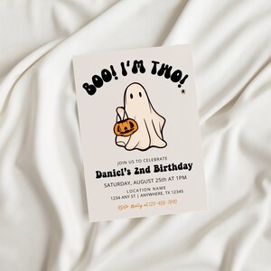 May include: A Halloween-themed birthday invitation with a cartoon ghost holding a jack-o'-lantern. The invitation reads "BOO! I'M THO!" and includes details for Daniel's 2nd birthday party.