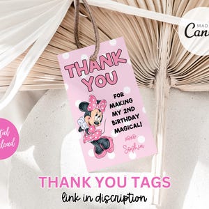 May include: Pink thank you tags with a cartoon image of Minnie Mouse. The text on the tag reads "Thank You for making my 2nd birthday magical! xoxo Sophia".