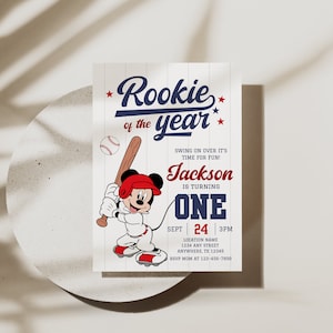 May include: Baseball-themed birthday invitation with a cartoon Mickey Mouse character holding a bat. The invitation says "Rookie of the year" and includes the name "Jackson" and the age "One".