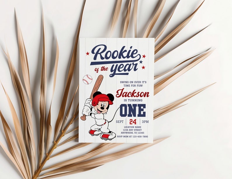 May include: A baseball-themed birthday invitation with a cartoon Mickey Mouse character holding a bat. The invitation reads "Rookie of the year" and includes the name "Jackson" and the age "One".