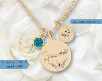 May include: Gold necklace with a stethoscope charm, a small charm with the letters "RN" and a blue crystal. The stethoscope charm has the name "Samantha" engraved on it. The necklace is available in gold and silver.