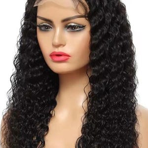 May include: A black curly wig with a lace front is shown. The wig features long, voluminous curls and is styled on a mannequin head. The text "DLH, You Are The Beauty" is at the top of the image, and "DLH" is at the bottom.