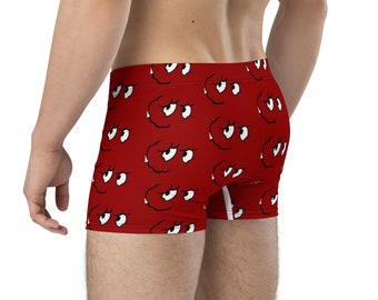 May include: Red boxer briefs with a white eye pattern.