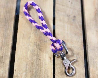 May include: A purple and pink braided rope leash with a silver clip.