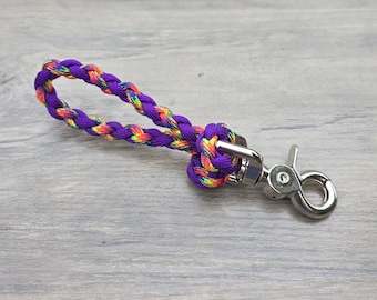 May include: A purple and rainbow braided rope leash with a silver swivel clip.