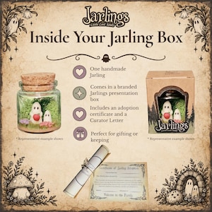 May include: A Jarlings Little Lost Souls product display featuring a glass jar with a cork lid containing two white ghost figures, one holding a red apple, on green moss. Includes a branded cardboard box, a rolled scroll, and an adoption certificate.