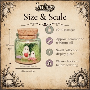 May include: A 50ml glass jar with a cork lid containing two small ghost figures, one holding a red apple, surrounded by green moss and small flowers. The text reads Jarlings Little Lost Souls, Size & Scale, 50ml glass jar, 47mm wide x 60mm tall.