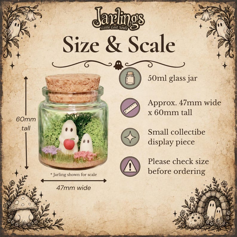 May include: A 50ml glass jar with a cork lid containing two small ghost figures, one holding a red apple, surrounded by green moss and small flowers. The text reads Jarlings Little Lost Souls, Size & Scale, 50ml glass jar, 47mm wide x 60mm tall.