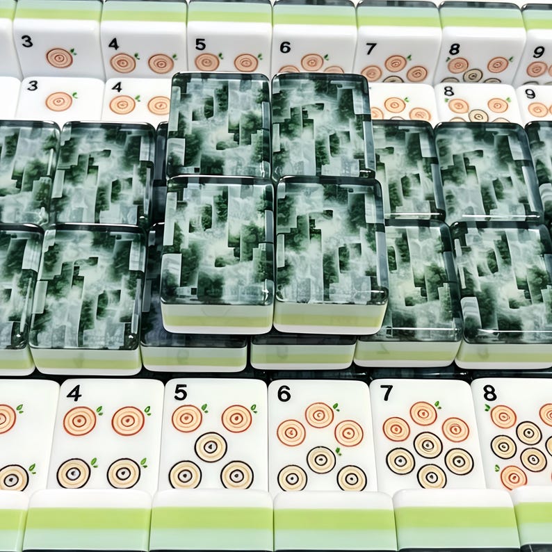 May include: A collection of mahjong tiles featuring white rectangular blocks with green and light green bases. Some tiles display numerical digits and circular wood grain patterns, while others feature a dark green and white marbled design.