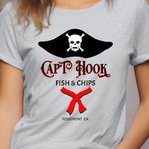May include: A gray t-shirt with a black and white pirate hat graphic and the text "Capt Hook Fish & Chips Ridgemont CA".