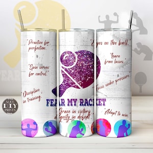 May include: White tumbler with a purple and pink glitter paddle and the text "FEAR MY RACKET" in red. The tumbler has inspirational quotes about playing paddle, including "Practice for perfection", "Spin serves for control", "Discipline in training", "Eyes on the ball", "Learn from losses", "Focus under pressure", "Grace in victory, dignity in defeat", and "Adapt to win".