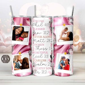 May include: Pink stainless steel tumbler with a pink and white marble design. The tumbler has four photos of a mother and child. The tumbler has inspirational quotes and bible verses printed on it. The text includes: "Strong Phil 4:13 Blessed Prov 31:25 Never Alone Matt 28:20 Chosen ! Thess 1:4 Beautiful Eccl 3:11 Fearless Psalm 23:4 Greatly Loved Jer 31:3"