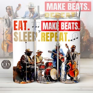 May include: A white tumbler with a band of red and gold around the middle. The tumbler features a watercolor illustration of a band playing music. The text "EAT. SLEEP. REPEAT." is printed in gold on the left side of the tumbler. The text "MAKE BEATS. REPEAT." is printed in red on the right side of the tumbler.