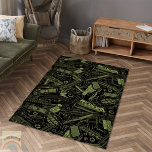 May include: A rectangular rug featuring a black backdrop with a repeating pattern of green weapon illustrations. The rug is placed on a wooden floor, and the design includes various firearms and grenades.