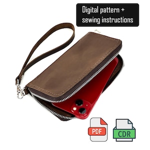 Puede incluir: Una cartera de mano de cuero marrón con cremallera plateada y correa a juego. Un teléfono inteligente rojo está guardado dentro de la cartera abierta. La imagen incluye el texto Digital pattern + sewing instructions y los iconos PDF y CDR.