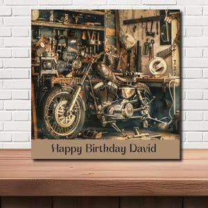 May include: A classic motorcycle in a workshop. The image shows a vintage motorbike with a detailed engine and wheels, surrounded by tools and equipment. The text "Happy Birthday David" is displayed at the bottom.