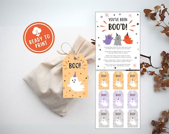 Può includere: Un sacchetto regalo a tema Halloween con un'etichetta che dice "BOO!" e presenta un fantasma con un cappello da festa. Include una carta con il testo "YOU'VE BEEN BOO'D!" e diverse etichette regalo con illustrazioni di fantasmi. Il sacchetto è pronto per la stampa.