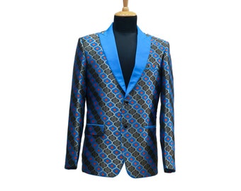 May include: A patterned blazer in blue, black, and orange, displayed on a mannequin. The jacket features a striking geometric design and a bright blue lapel and trim. The blazer has a two-button closure and a classic tailored fit.