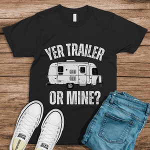 May include: Black t-shirt with a white camper van graphic and the text "Yer Trailer or Mine?"