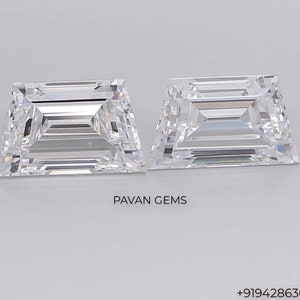 May include: Two clear, rectangular, faceted gemstones. The gemstones are cut in an emerald shape. The gemstones are on a white background.