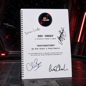 May include: A spiral-bound script titled Red Dwarf: A Situation Comedy in Space, Bodysnatcher by Rob Grant & Doug Naylor. The white cover features the Red Dwarf logo and four distinct black ink signatures from the cast members of the television show.