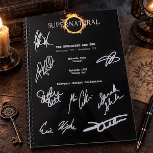 May include: A black spiral-bound souvenir script collection notebook titled SUPERNATURAL. The cover features white printed text including THE BEGINNING AND END, February '05 - November '20, Episode 0101 Pilot, Episode 1520 Carry On, and multiple white signatures.