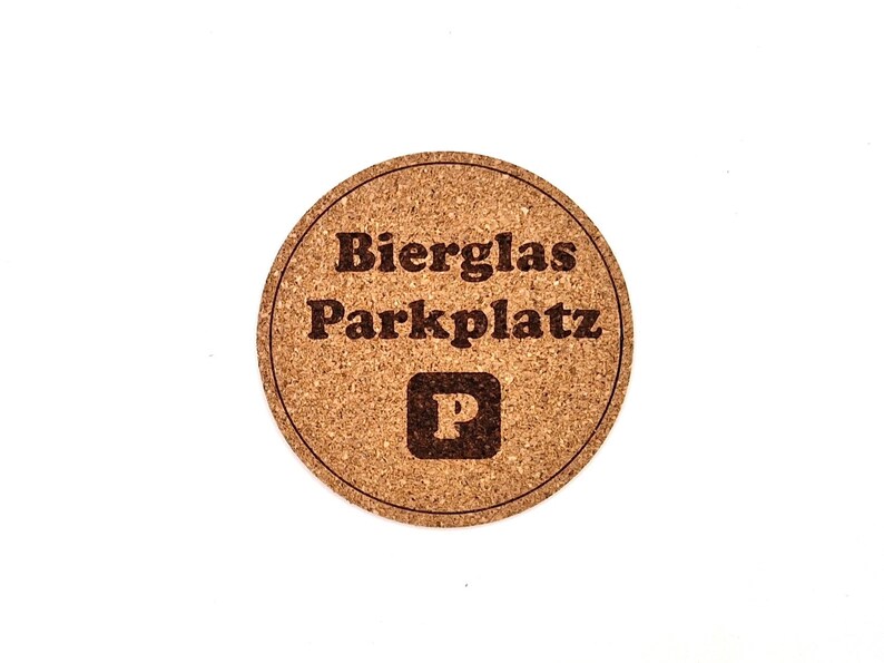 May include: A round cork coaster with the text "Bierglas Parkplatz" and a "P" symbol in the center.