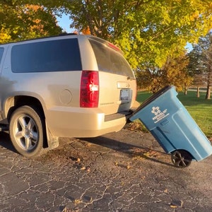 Garbage hauling device, haul garbage bins with or without a towbar, wheelie bin tower, BinTowa