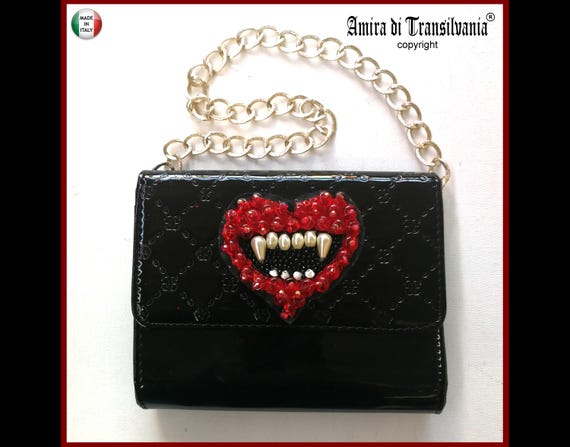 Designer black patent clutch bag deals