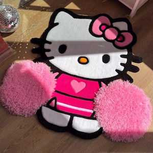 Alfombra rosa con pompones de animadora. Alfombra kawaii hecha a mano. Decoración esponjosa y adorable. Regalo personalizado para habitación de niña.