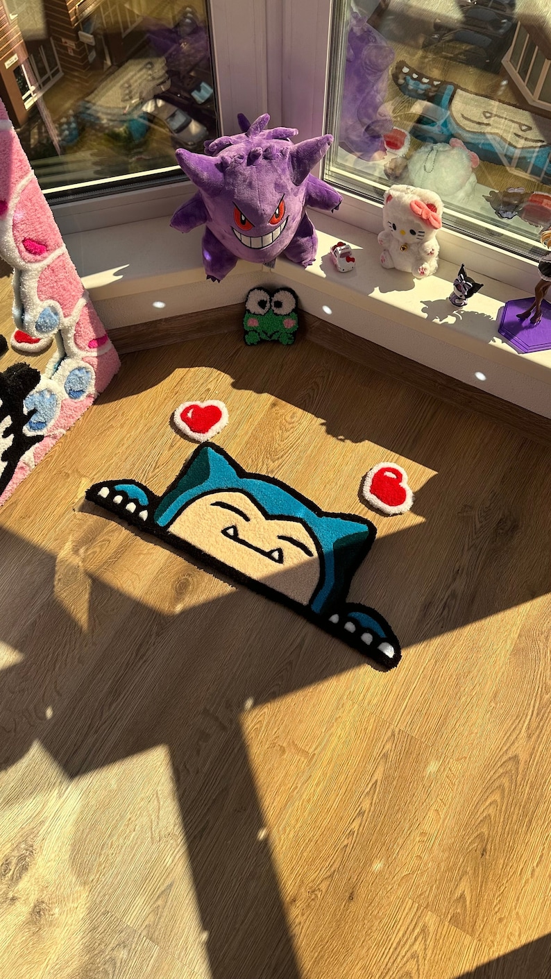 Unique handmade rug crafted with tufted technique, showing cute sleepy character in kawaii style, decorated with small floating hearts. Plush fluffy pile gives cozy comfortable feel. Perfect as anime rug, custom rug, or kawaii carpet for bedroom décor or nursery. Ideal handmade rug gift for couples, friends, or kawaii fans. Adds playful cheerful energy, cozy comfort, and colorful accent to room