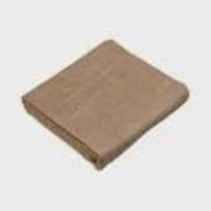 May include: Folded tan blanket. The blanket appears to be made of a woven material. The edges are neatly folded, and the blanket is rectangular in shape. The color is a neutral tan, suitable for various home decor styles.