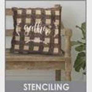 May include: A brown and tan plaid pillow with the word "gather" in a cursive font. The pillow is on a wooden bench. The word "STENCILING" is in a gray box at the bottom of the image.