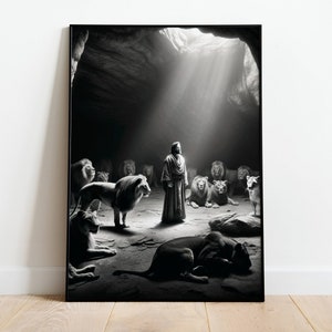 May include: A black and white photograph of a man standing in a cave with a group of lions surrounding him. The man is wearing a robe and the lions are all looking at him. A beam of light shines down from the cave ceiling.