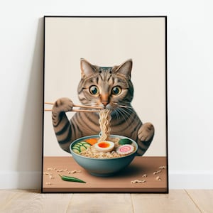 May include: A tabby cat with green eyes is eating ramen noodles with chopsticks. The cat is sitting at a table with a bowl of ramen in front of it. The ramen has a boiled egg, spring onions, and a pink fish cake.
