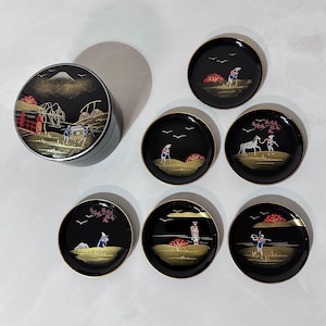 May include: A set of three ceramic mugs with a speckled, matte finish. The mugs are in shades of cream, light gray, and dark gray. Each mug has a simple, minimalist design and a rounded handle.