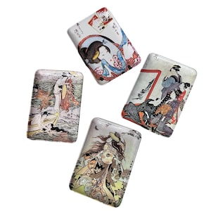 May include: Four rectangular trays with Japanese art prints. Each tray features a different colorful illustration of geishas and scenes from Japanese culture. The trays have a glossy finish and are set against a white background.