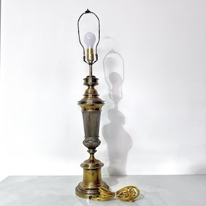 May include: A set of three ceramic mugs with a speckled, matte finish. The mugs are in shades of cream, light gray, and dark gray. Each mug has a simple, minimalist design, perfect for coffee or tea.