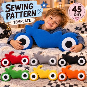 May include: A sewing pattern template for a motorcycle-shaped pillow, featuring a blue motorcycle plush toy and six smaller versions in red, gray, black, green, yellow, and orange. The text reads Sewing Pattern Template and 45 cm.